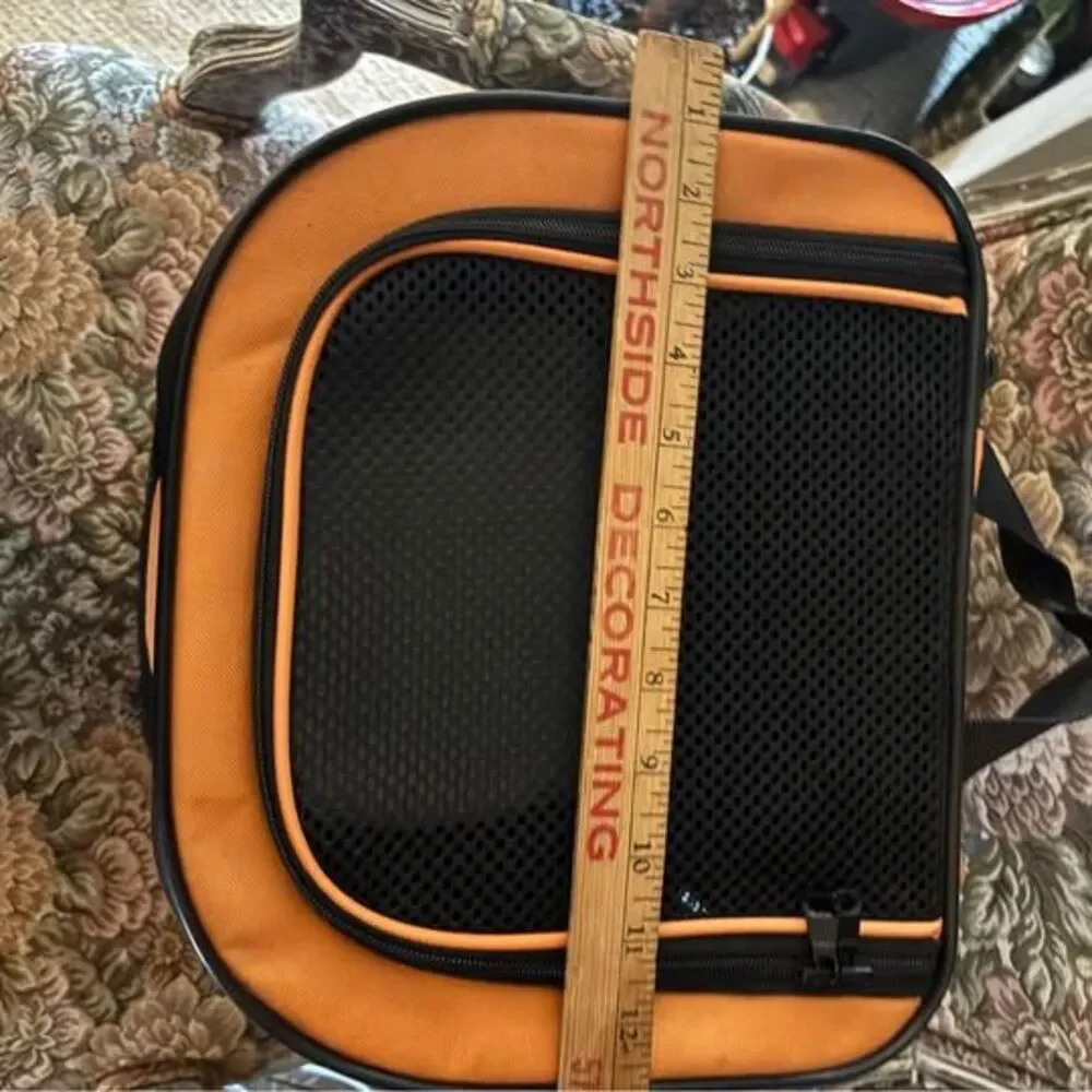 Orange and black soft-sided pet carrier, about 18x12x9 inches